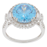 Round blue topaz sterling silver ring with sparkling accents, showcasing elegant gemstone brilliance.